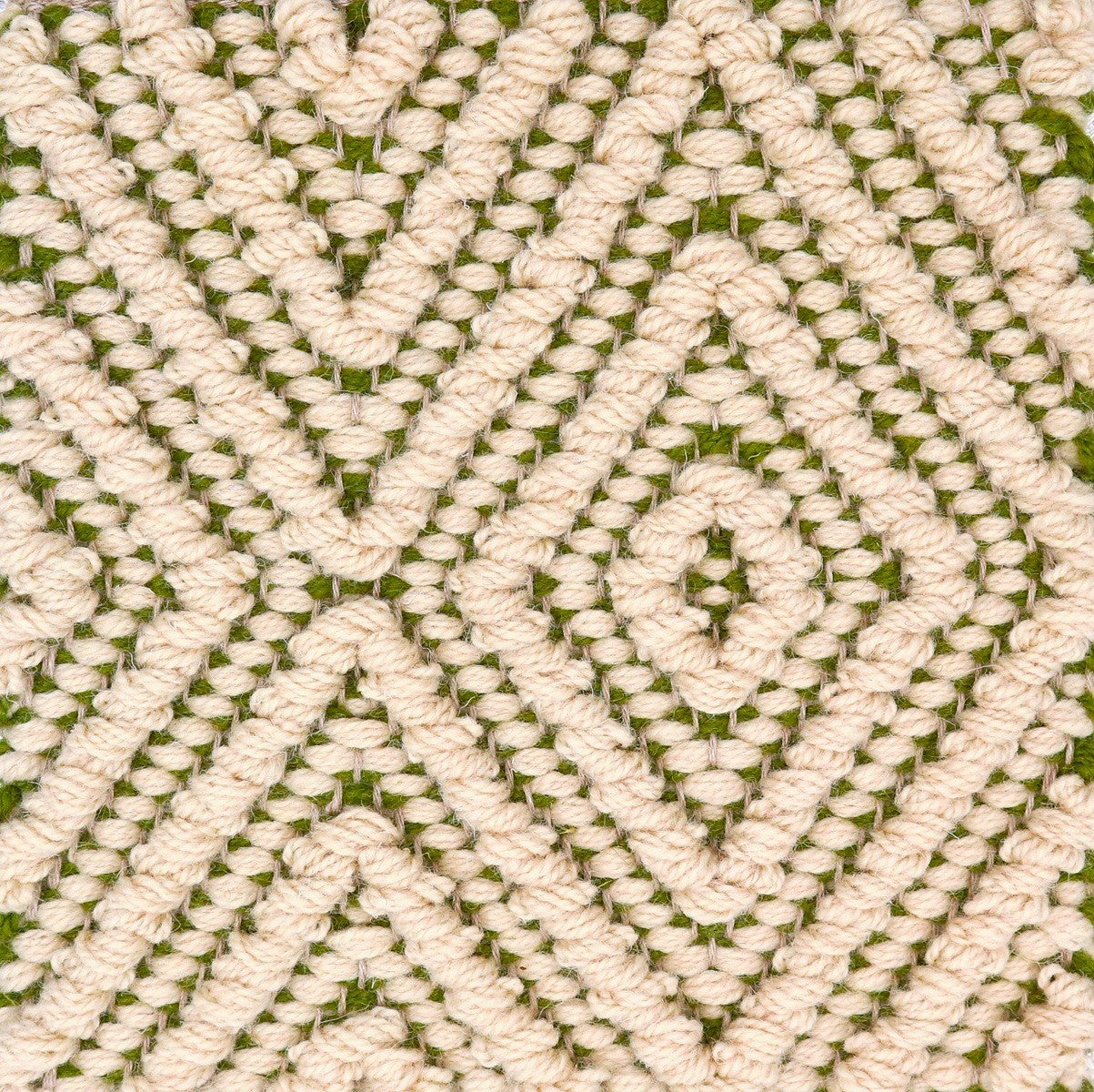 <p>Big Diamond Twill in Bouclé, main cream 6023, inside green CH015 on the natural yarn warmer</p>