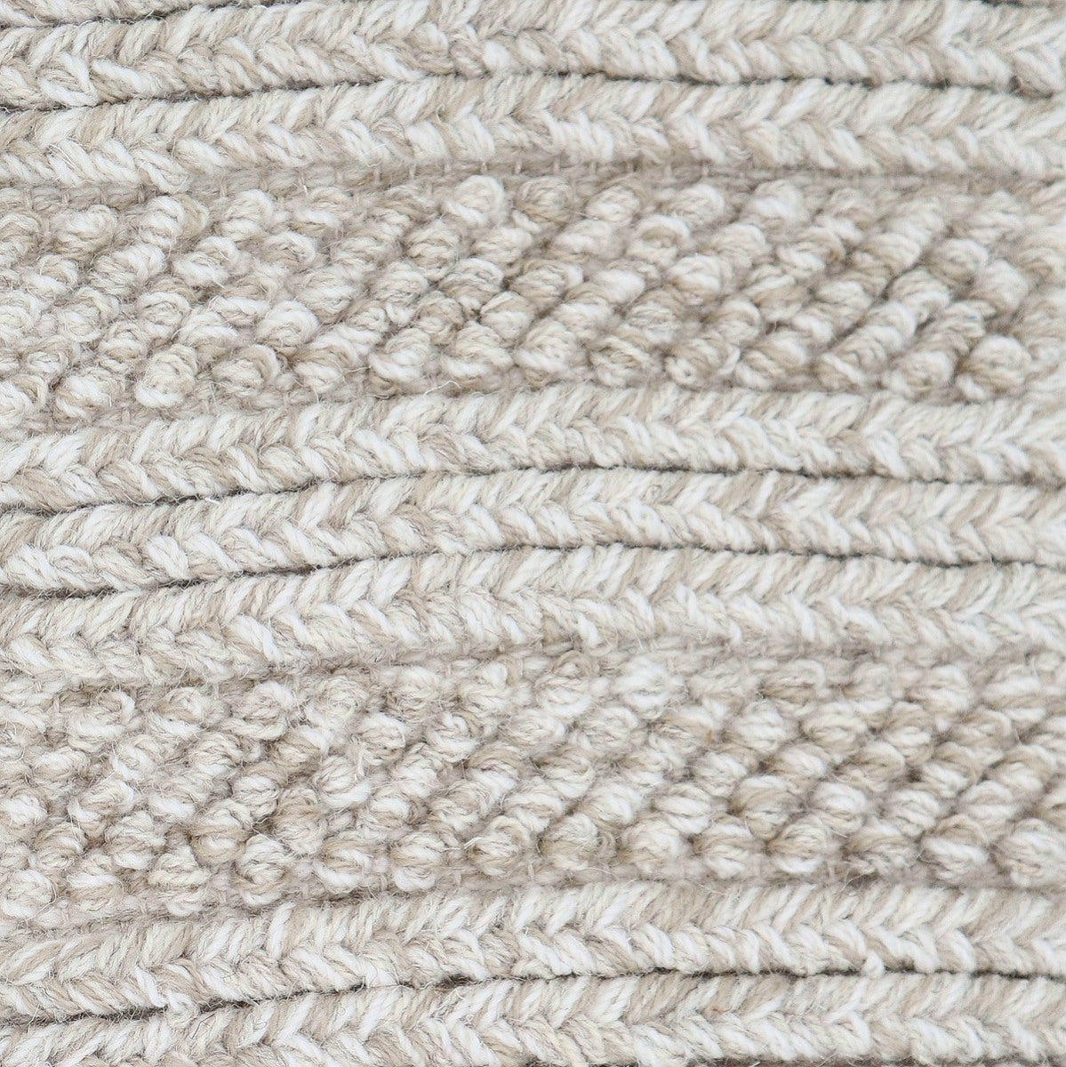 <p>Braids and Bouclé Pearls, grey mix 12, 1023, 1011 on the natural yarn</p>