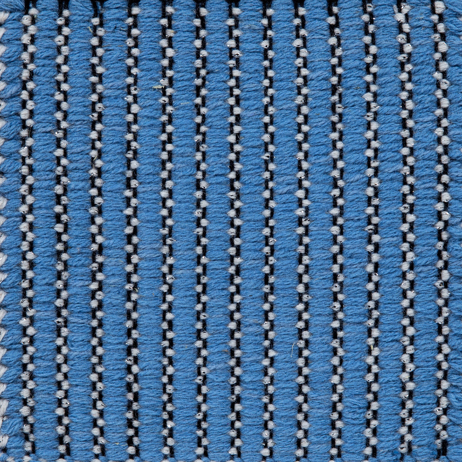 <p>Carpathian Metallic Twisted Field, main light blue 5001, inside white 1023, 1023 with silver metallic eff. (1thr.) on the black yarn</p>