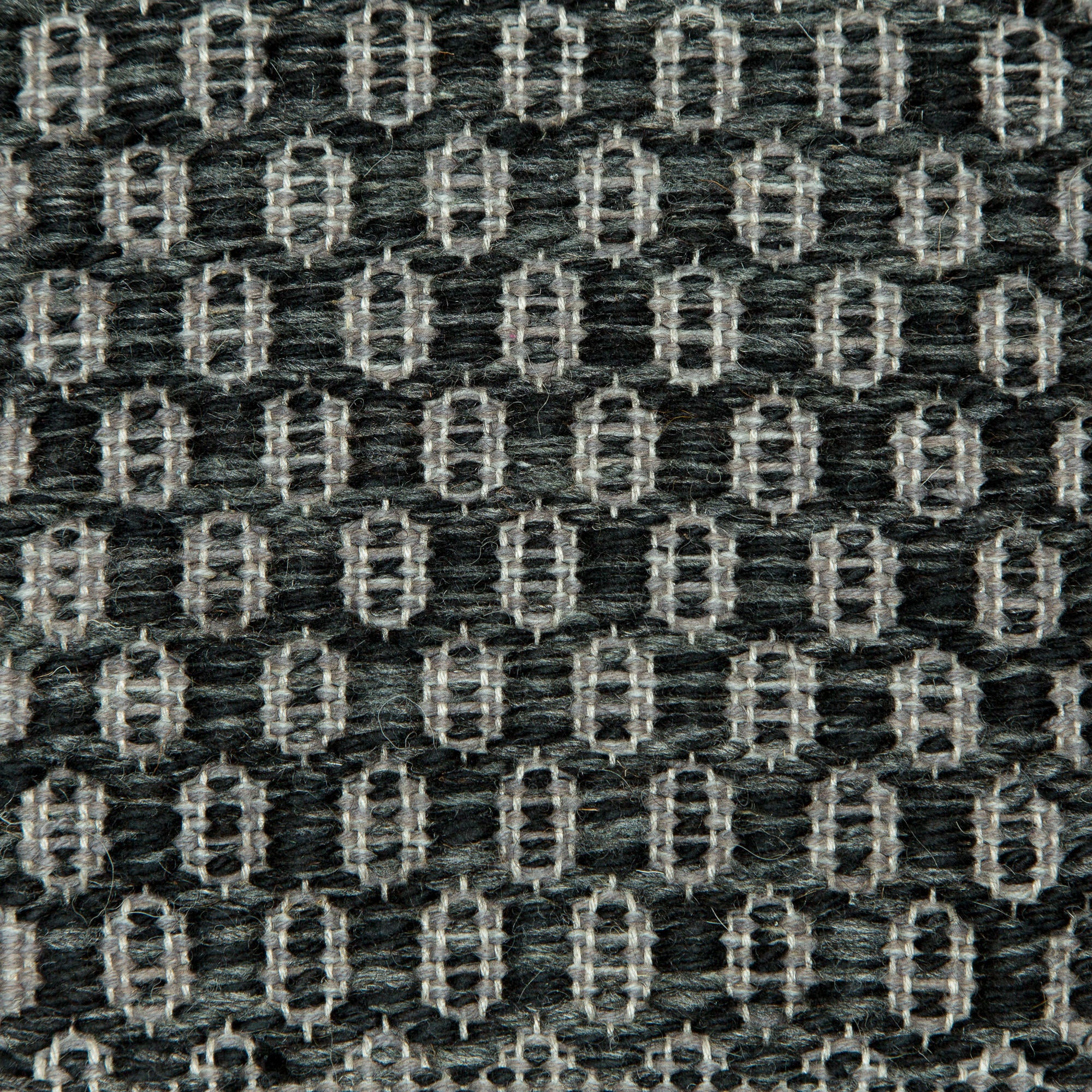 <p>Honeycombs, main black mix 05, 1006 ins. grey mix 1009, 1003, 1021 on the natural yarn</p>