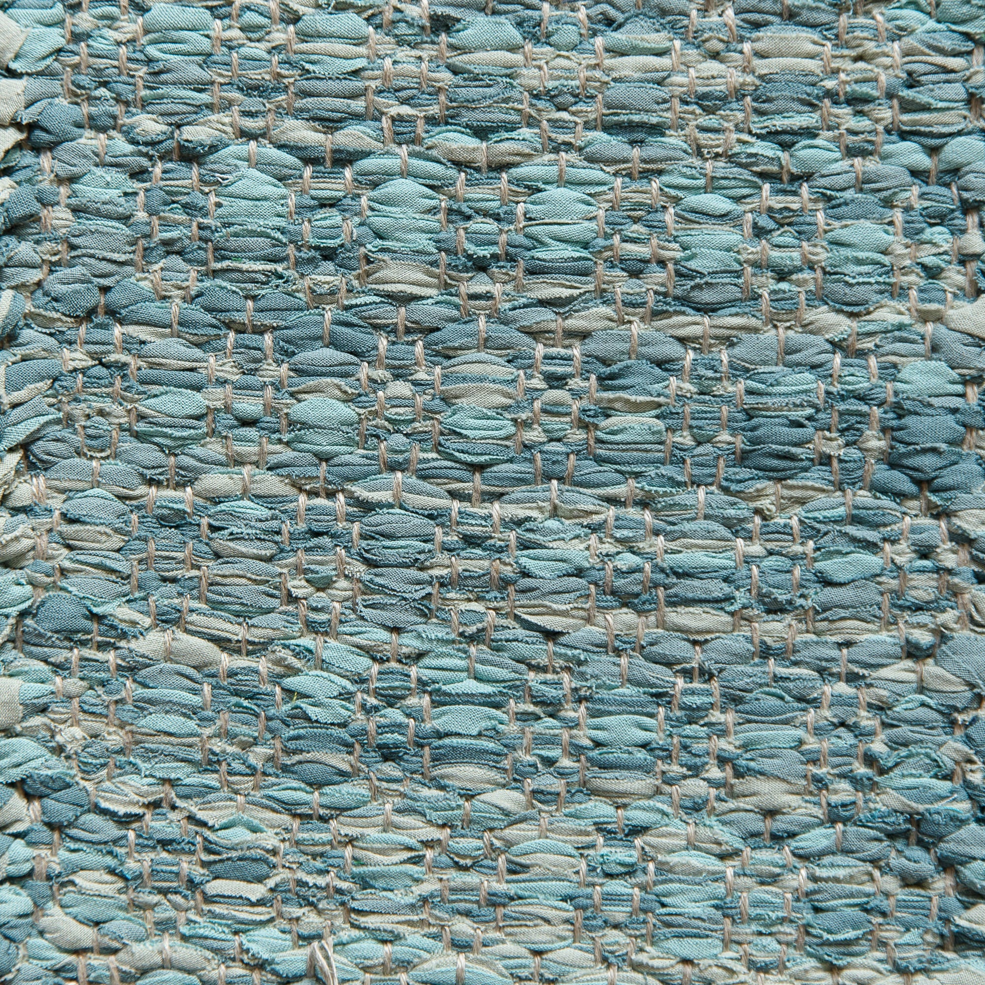 <p>Honeycombs, blue green mix 405, 411, 433, 469 on the natural yarn</p>