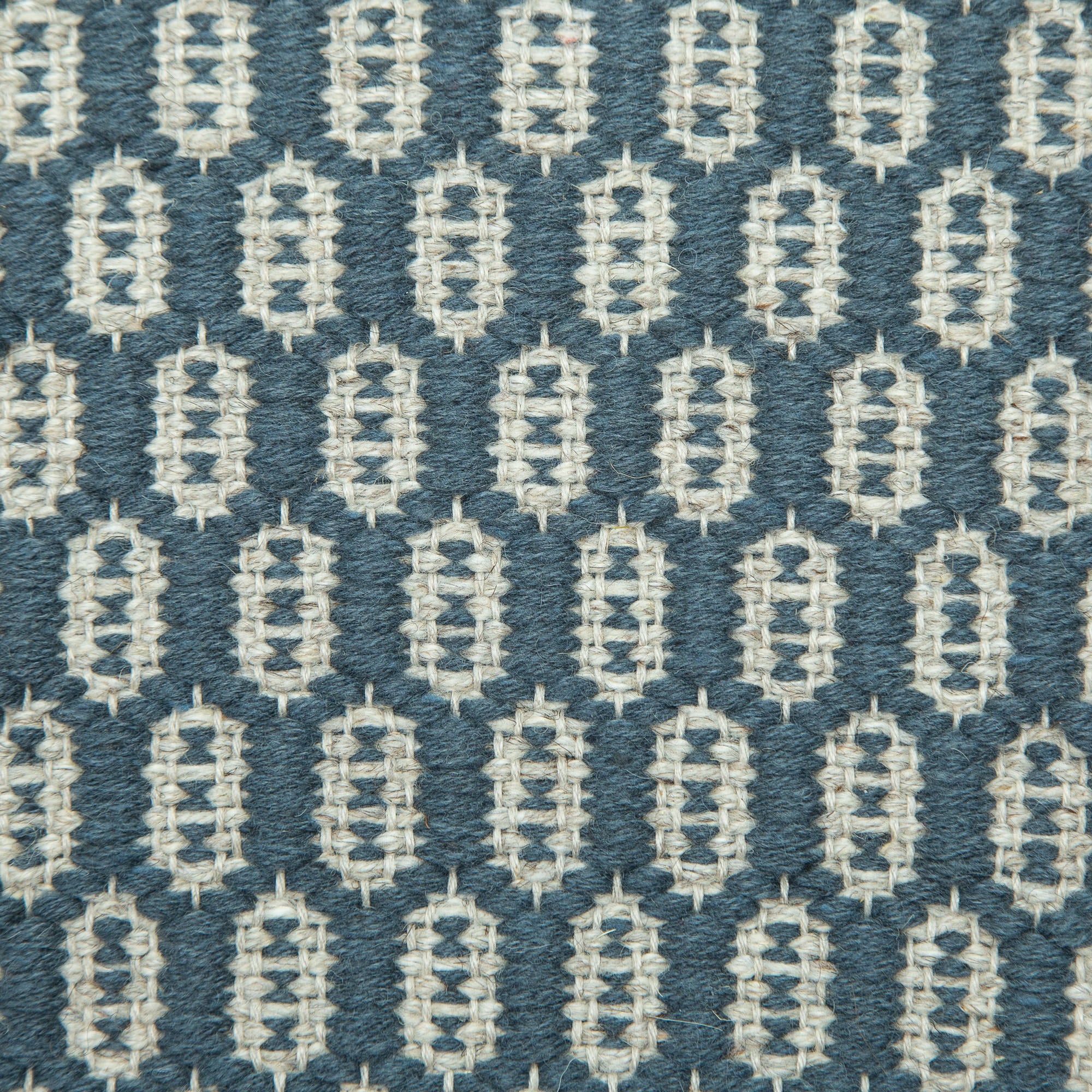 <p>Honeycombs, main blue 504, inside light grey 12 on the natural yarn</p>