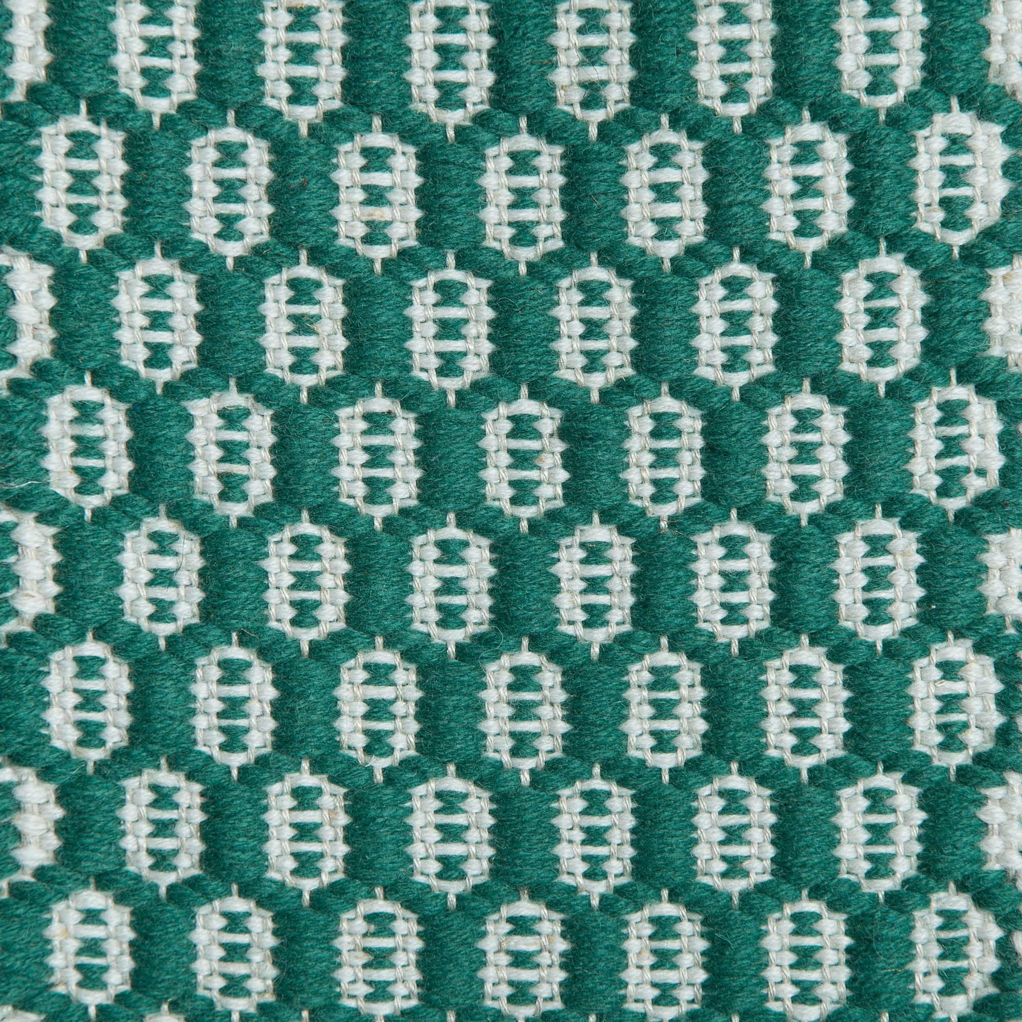 <p>Honeycombs, main green 4008, inside white 1023 on the natural yarn</p>