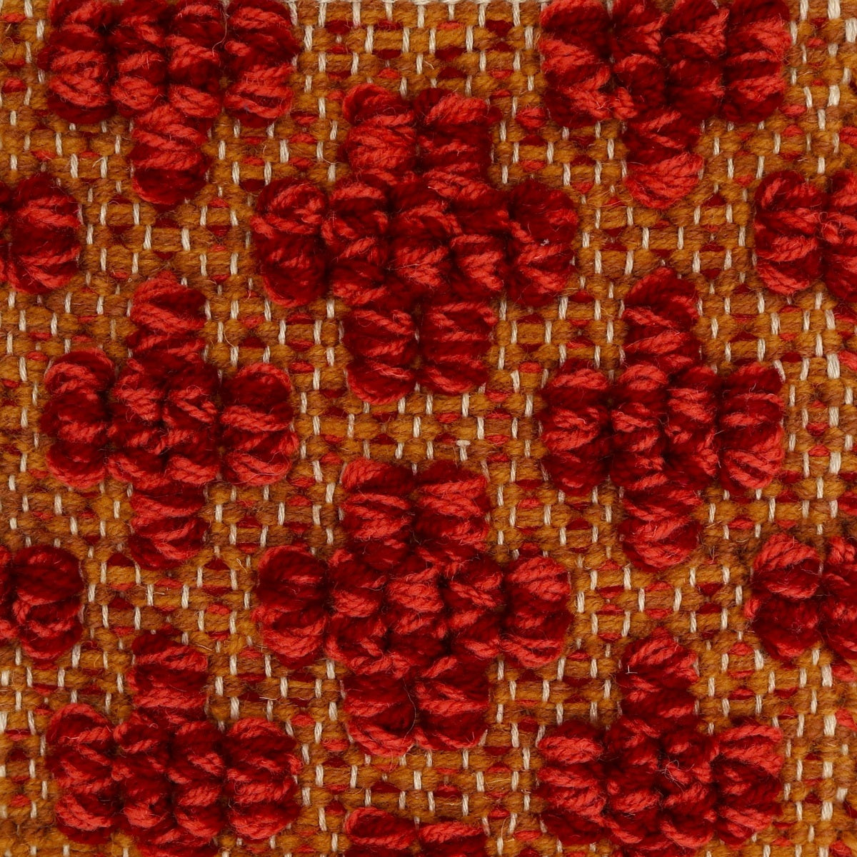 <p>Mini Flower in Bouclé, base mustard mix CH018, 8124, cross in bouclé in red mix 3015, 8154 on the natural yarn</p>