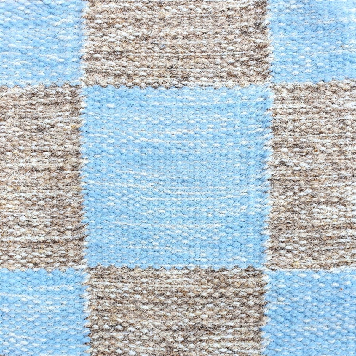 <p>Single Weave Chequered, sq 1 - light blue mix 5032, 5012, 6023, sq 2 - beige mix 02, 03, 6023 on the natural yarn</p>