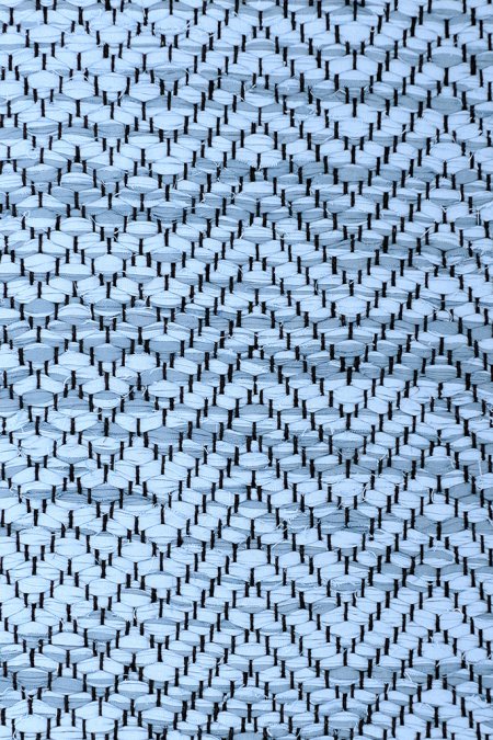 <p>Very large turns of Herringbone on one side slowly moving into Zig zag towards the other end, blue mix 501/1, 157; yarn - black</p>