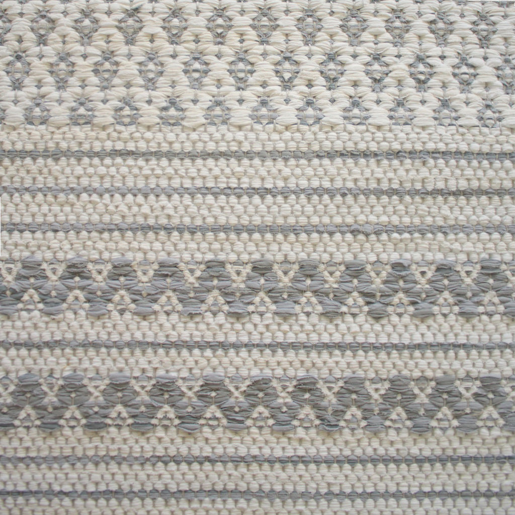 <p>Ukrainian Flowers and Single Weave Striped, main white 101, inside grey 150, Zig Zag in grey mix 128, 129, 150 on the natural yarn</p>